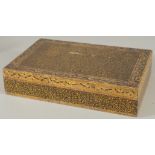 A KASHMIRI LIDDED WOODEN BOX, 24cm x 15.5cm.