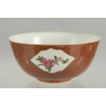 A CHINESE FAMILLE ROSE PANELLED PORCELAIN BOWL, possibly Kangxi, 12cm diameter.