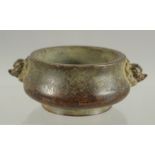 A SMALL CHINESE TWIN HANDLE BRONZE CENSER, 10cm wide.