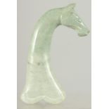 A CARVED HARDSTONE DAGGER HANDLE IN THE FORM OF A HORSE HEAD, 16cm long.