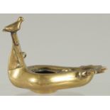 A ROMAN / GREEK STYLE BRASS OIL LAMP, 10.5cm long.