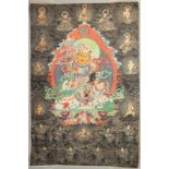 A TIBETAN THANGKA, mounted on paper.