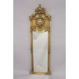 A LONG GILTWOOD MIRROR with lion masks. 5ft 9ins high, 1ft 7ins wide.