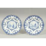 A ROYAL CROWN DERBY PAIR OF PLATES, the centres painted with sailing vessels, by W.E.J. DEAN..