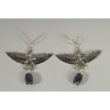 A PAIR OF SILVER FEMALE FIGURES AND WINGS EARRINGS.