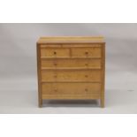 ROBERT "MOUSEMAN" THOMPSON. AN OAK CHEST OF DRAWERS, with adzed rectangular top, panelled ends,