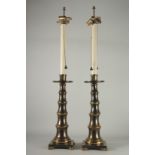 A TALL PAIR OF MARBLE AND BRONZE LAMPS. 43ins high.