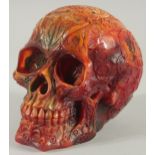 A CARVED AMBER SKULL. 5ins high.