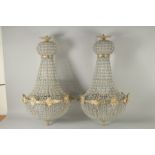 A PAIR OF CRYSTAL BEAD CHANDELIER. 32ins long.