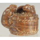 A CARVED WOOD NETSUKE, two rats. 1.5ins.