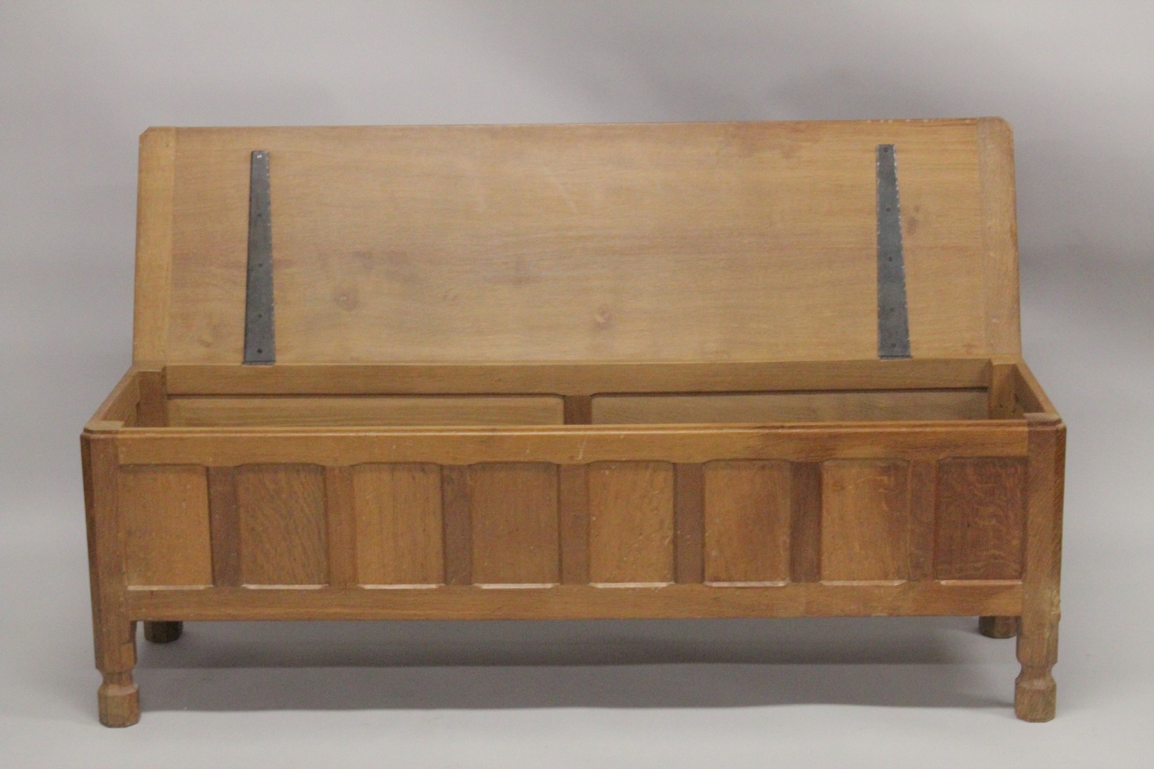 ROBERT "MOUSEMAN" THOMPSON. AN OAK OTTOMAN, with an adzed rectangular rising top, panelled front and - Image 2 of 6
