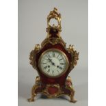 A 19TH CENTURY FRENCH TORTOISESHELL AND ONYX CLOCK with acanthus scrolls. 10ins high.