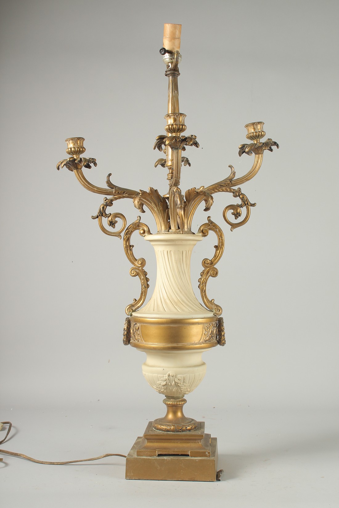 A 19TH CENTURY FRENCH WHITE MARBLE AND FOUR BRANCH ORMOLU LAMP on a square base. 29ins high.