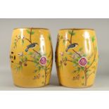 A GOOD PAIR OF CHINESE YELLOW PORCELAIN BARRELL SEATS decorated with birds. 18ins high.