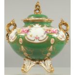 A FINE ROYAL CROWN DERBY VASE AND COVER painted with flowers above a green ground by A.F. WOOD.