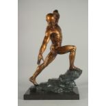 A LARGE ANATOMICAL BRONZE ATHLETE on a marble base.