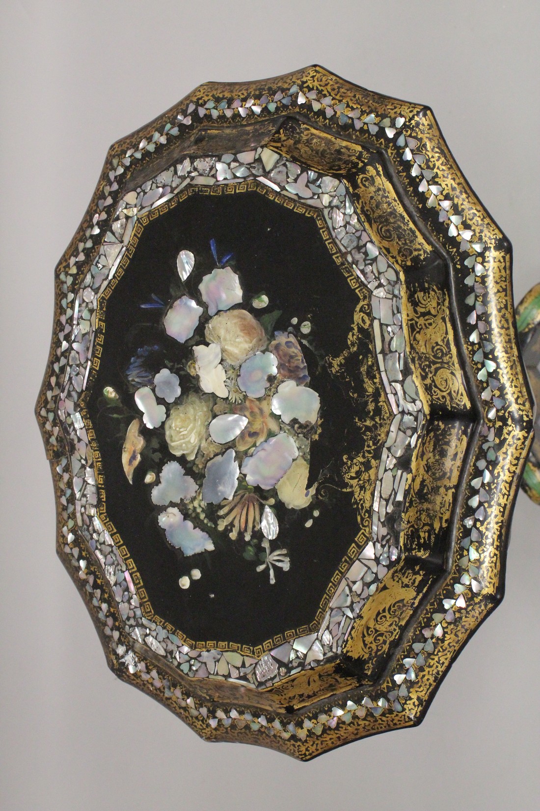 A VICTORIAN PAPIER MACHE TEA POUY ON A TRIPOD BASE, inlaid with mother of pearl and decorated in - Image 2 of 7