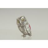 A NOVELTY SILVER OWL PIN CUSHION. 1.25ins long.