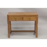 ROBERT "MOUSEMAN" THOMPSON. AN OAK SIDE TABLE with an adzed rectangular top, two frieze drawers with