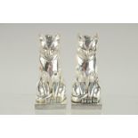 A PAIR OF ART DECO STYLE SILVER PLATED CAT SALT AND PEPPERS. 3ins high.