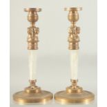 A GOOD PAIR OF REGENCY DESIGN ROCK CRYSTAL CIRCULAR CANDLESTICKS after Thomas Hope, on circular