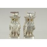 A PAIR OF ART DECO STYLE OWL SALT AND PEPPERS. 2.75ins high.
