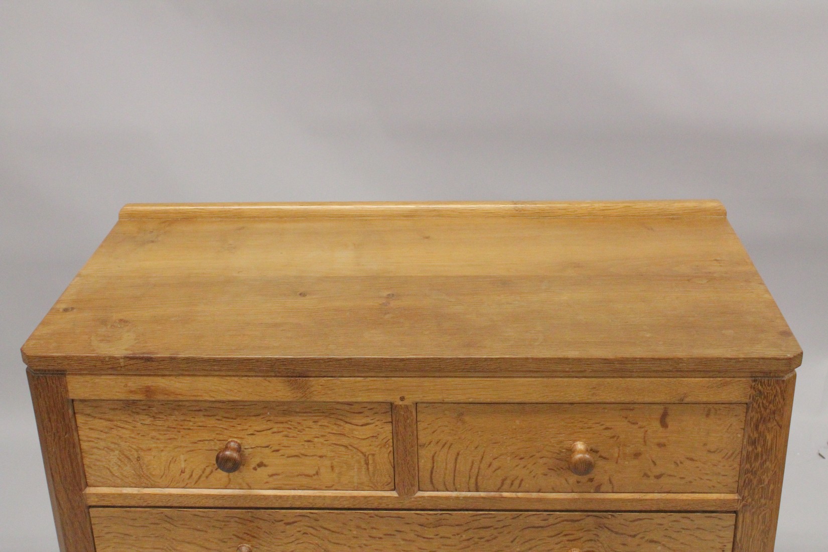 ROBERT "MOUSEMAN" THOMPSON. AN OAK CHEST OF DRAWERS, with adzed rectangular top, panelled ends, - Image 3 of 5