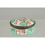 A BILSTON BLUE OVAL BOX painted with flowers. 2ins x 1.5ins.