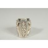 A SILVER COFFIN AND SKELETON BATS WING RING.