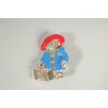 A SILVER AND ENAMEL PADDINGTON BEAR BROOCH.