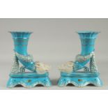 A PAIR OF SEVRES DESIGN LIGHT BLUE CORNUCOPIA BOARS HEAD VASES. 11ins high.