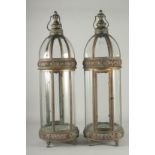 A LARGE PAIR OF COPPER AND GLASS CIRCULAR LANTERNS. 31ins high.