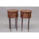 A GOOD PAIR OF LOUIS XVITH STYLE INLAID OVAL BEDSIDE TABLES with three drawers on curving legs.