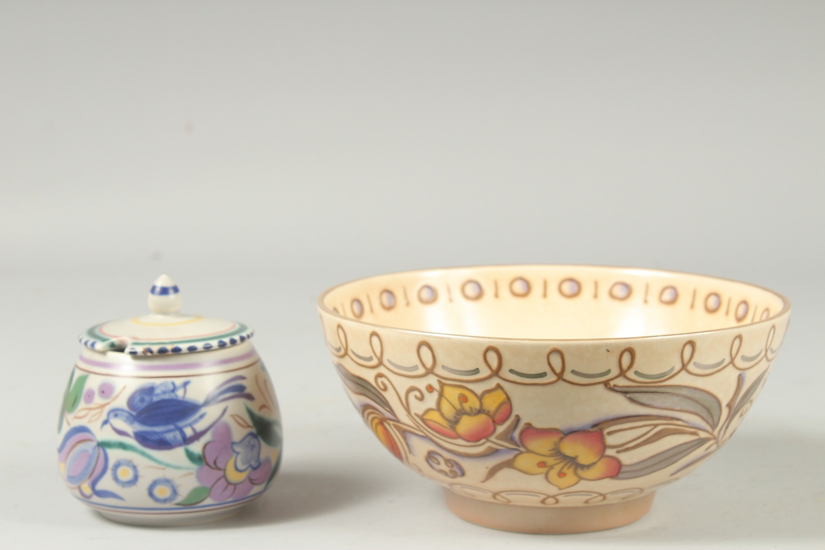 A BURLEY WARE CHARLOTTE READ CIRCULAR BOWL, 7.5ins diameter, and a POOLE HONEY POT AND COVER. 3.