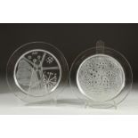 TWO LALIQUE CIRCULAR GLASS PLATES. 1961 & 1974. 8.24ins diameter.