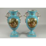 A LARGE PAIR OF SEVRES DESIGN TWO HANDLED URN SHAPED VASES with reverse oval of classical figures.
