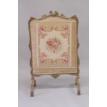 A GOOD 19TH CENTURY FRENCH GILTWOOD FIRE SCREEN with needlework panel. 3ft 7ins high 2ft 2ins wide.