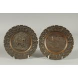 A GOOD PAIR OF CAST BRONZE CIRCULAR PLATES.