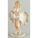 A PAINTED CAST IRON MARILYN MONROE. 13ins high.