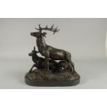 AFTER P. J. MENE A BRONZE STAG, DOE AND DOG on a marble base. Signed. 14ins high.