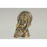 A NOVELTY BRASS MAN'S HEAD VESTA. 2.25ins high.