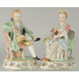 A PAIR OF SITZENDORF PORCELAIN FIGURES of a young man sitting legs crossed and a young lady. 5.