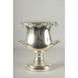 A GOOD PAIR OF PLATED TWO HANDLED URN SHAPED WINE COOLERS. 12ins high.