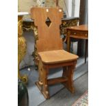 A PAIR OF ARTS AND CRAFTS GOTHIC REVIVAL WALNUT SIDE CHAIRS.