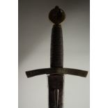 A SWORD WITH WIRE HANDLE in a leather sheath.