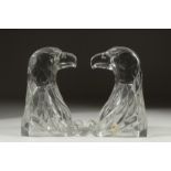 A PAIR OF GLASS EAGLE BOOK ENDS.
