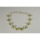 A SILVER PERIDOT BRACELET.