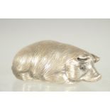 A RUSSIAN SILVER SLEEPING PIG. Mark: Head 84 Faberge I. P.. 2.5ins long.