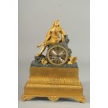 A GOOD EMPIRE ORMOLU AND BRONZE CLOCK the case with a single gilded figure. 13ins high.