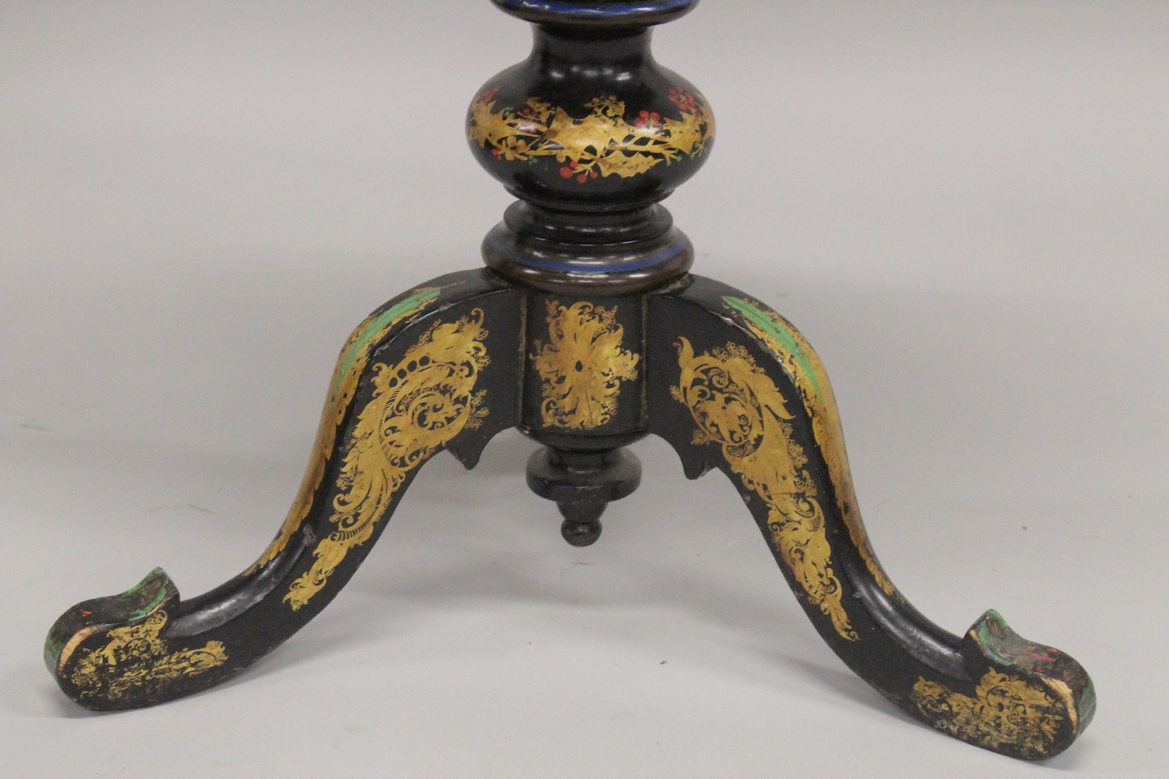 A VICTORIAN PAPIER MACHE TEA POUY ON A TRIPOD BASE, inlaid with mother of pearl and decorated in - Image 6 of 7